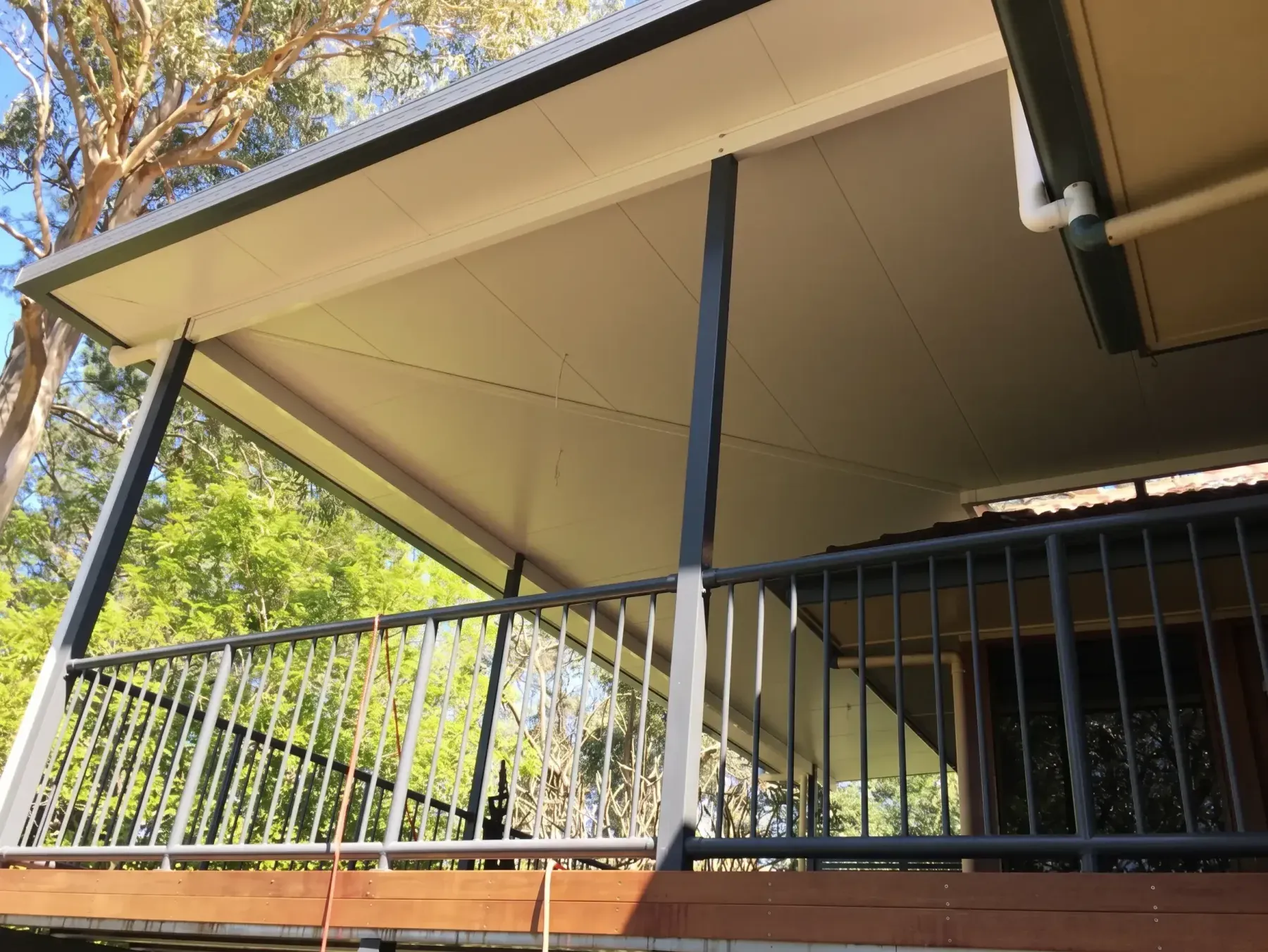 Raised patio with a balustrade over a garden