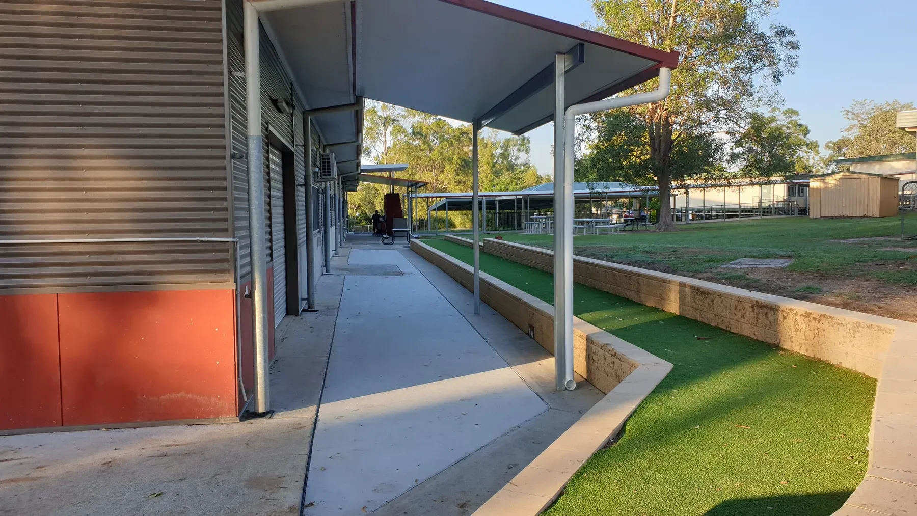Covered walkway beside school buildings