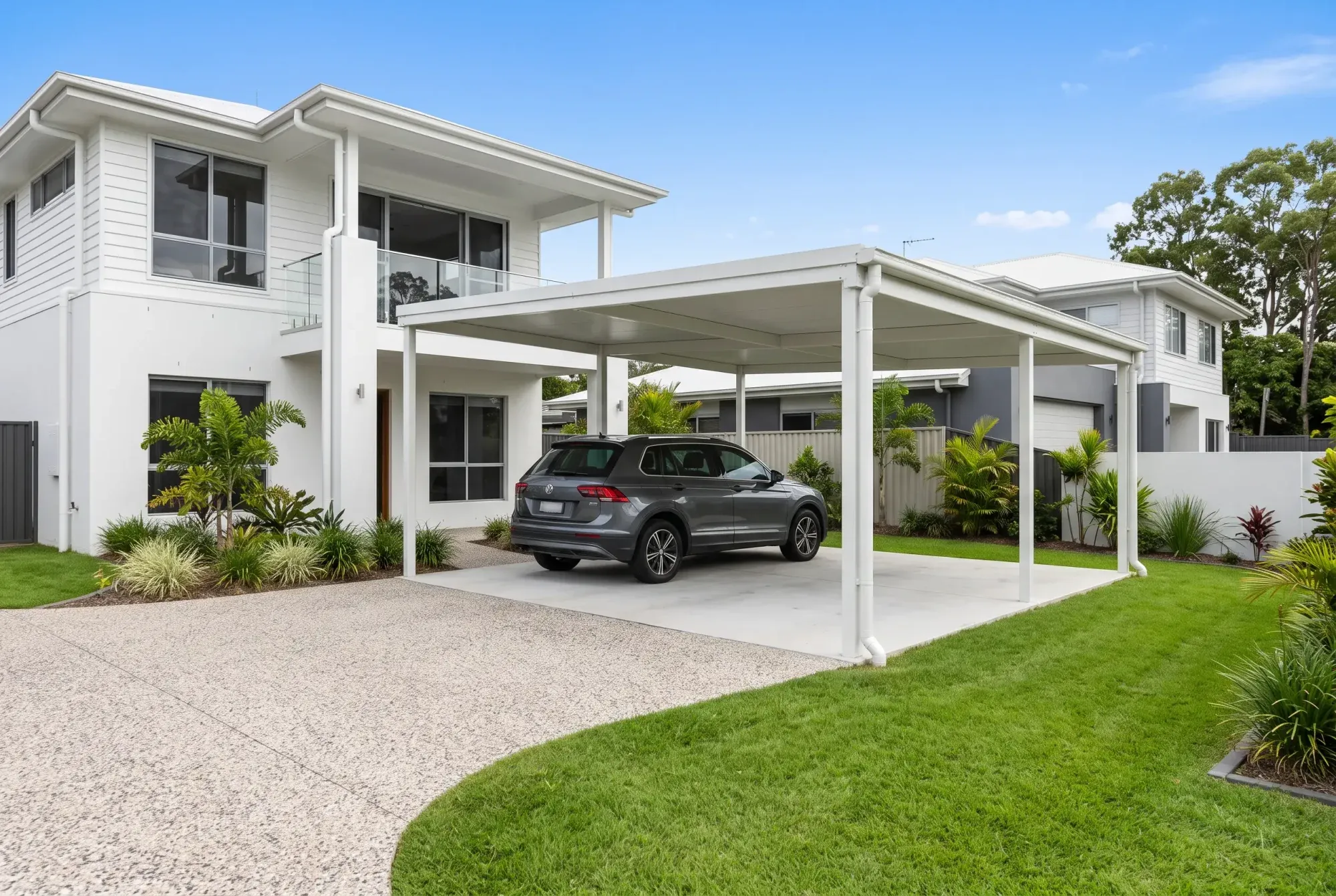 Flat skillion carport beside a modern white home