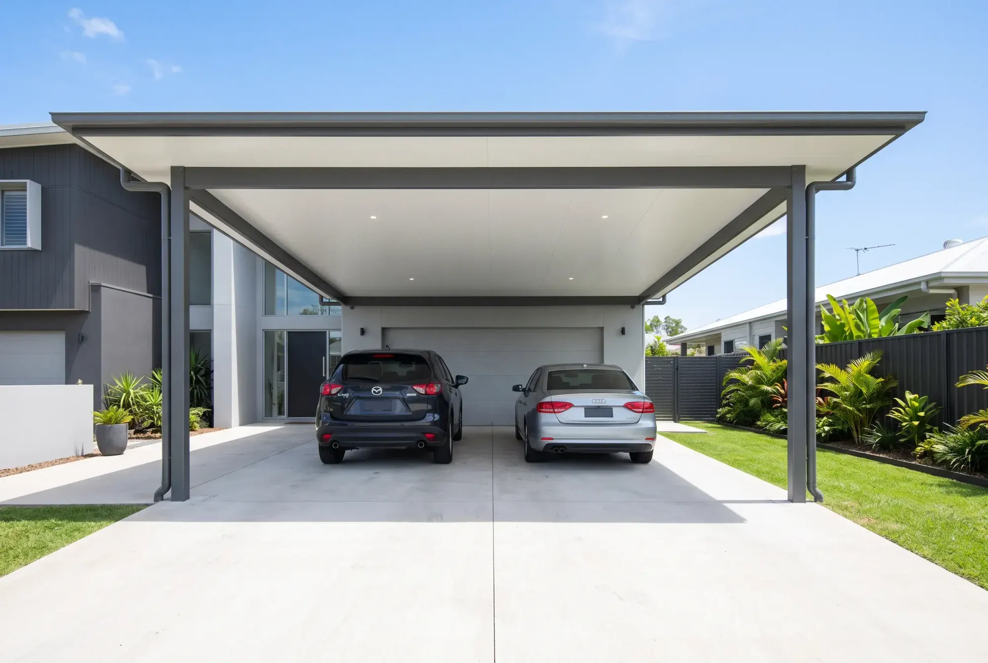 Insulated carport with a white panel ceiling and downlights over a driveway