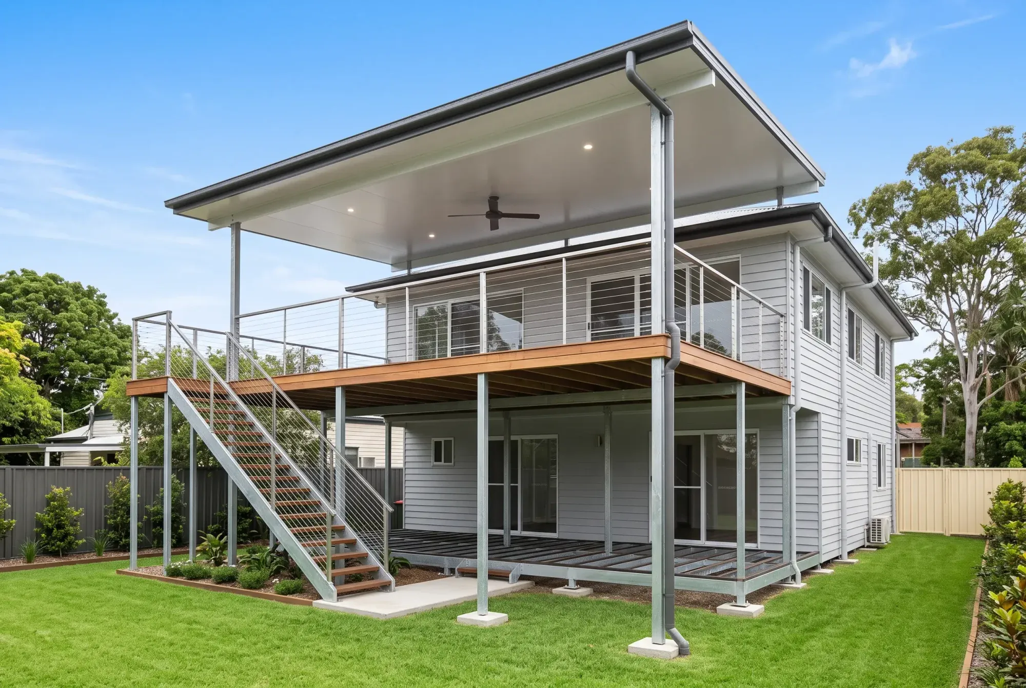 High steel-framed deck with steel stairs under an insulated roof