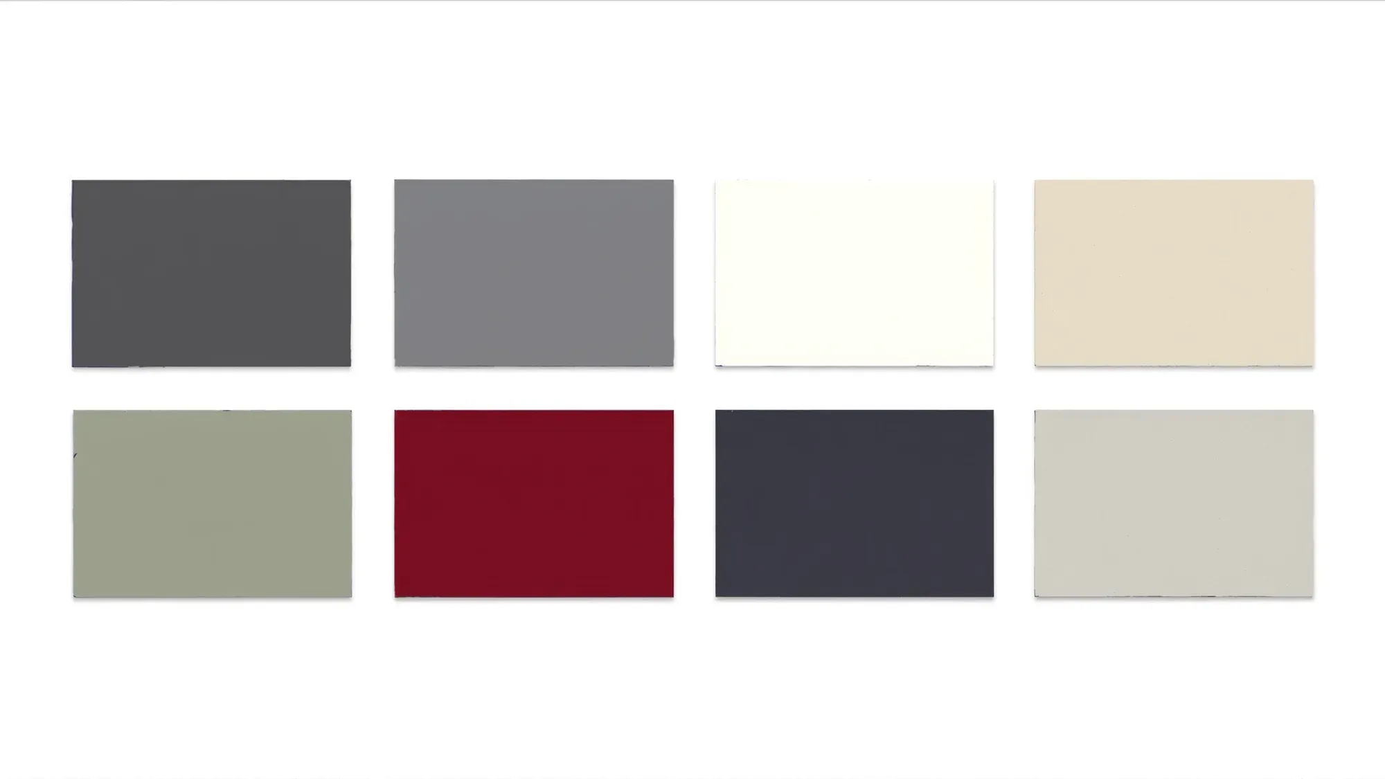 Flat-lay of painted steel roof colour sample chips in two rows