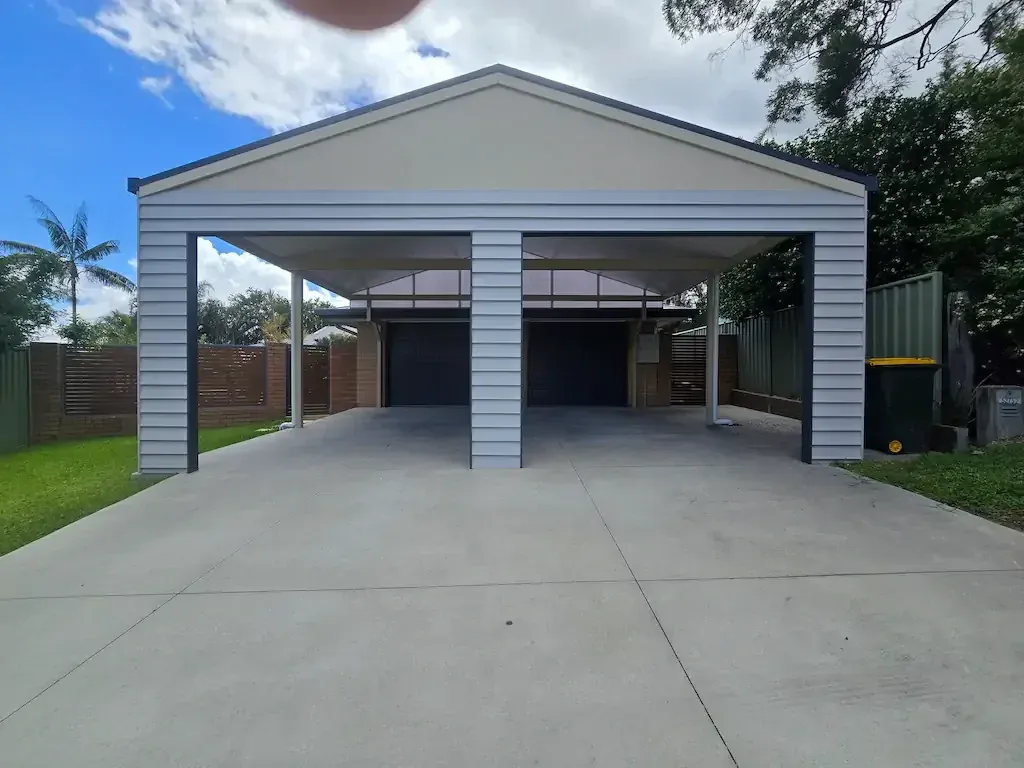 Elevated steel-framed deck with stairs down to a lawn