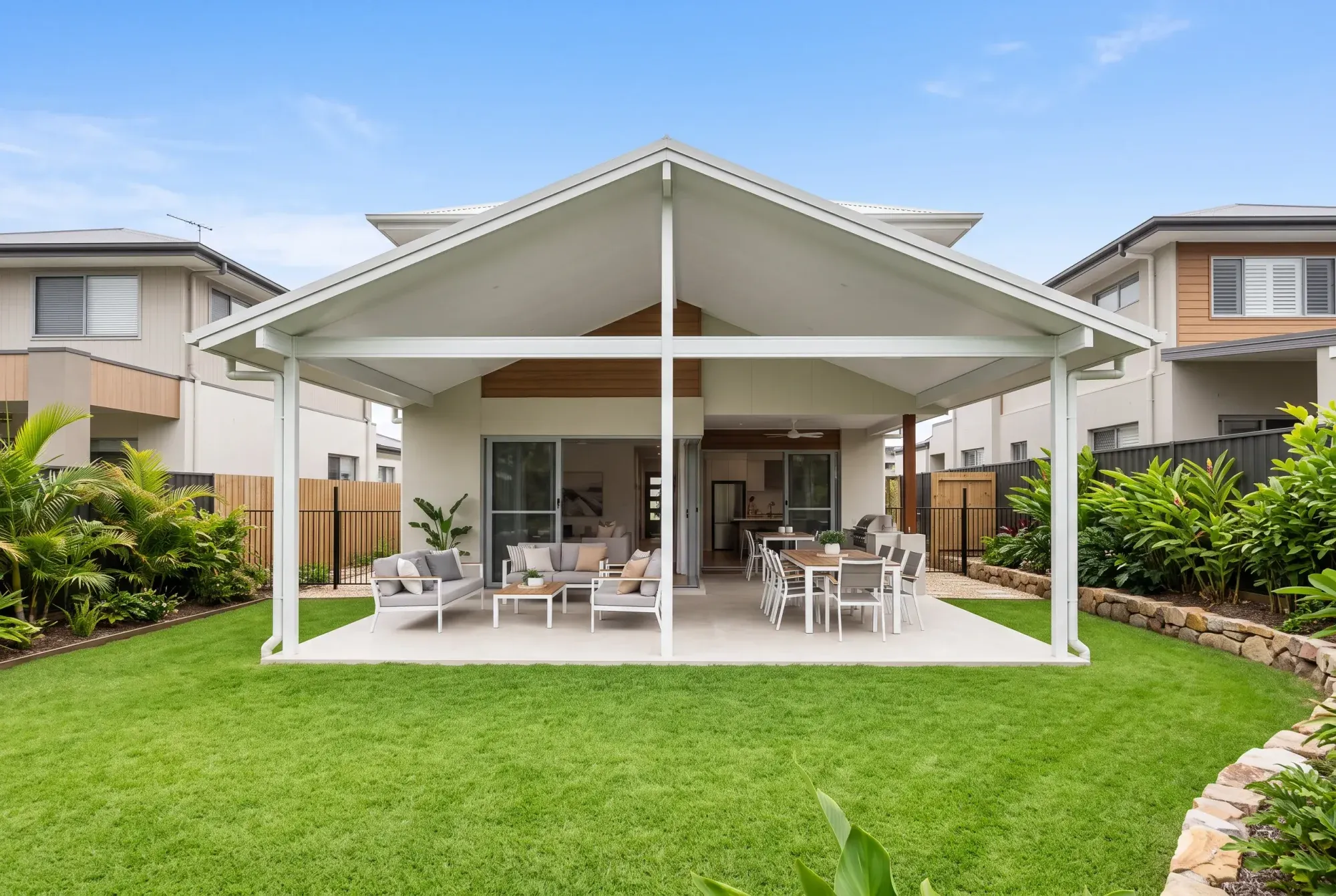 Gable patio roof over a garden entertaining area