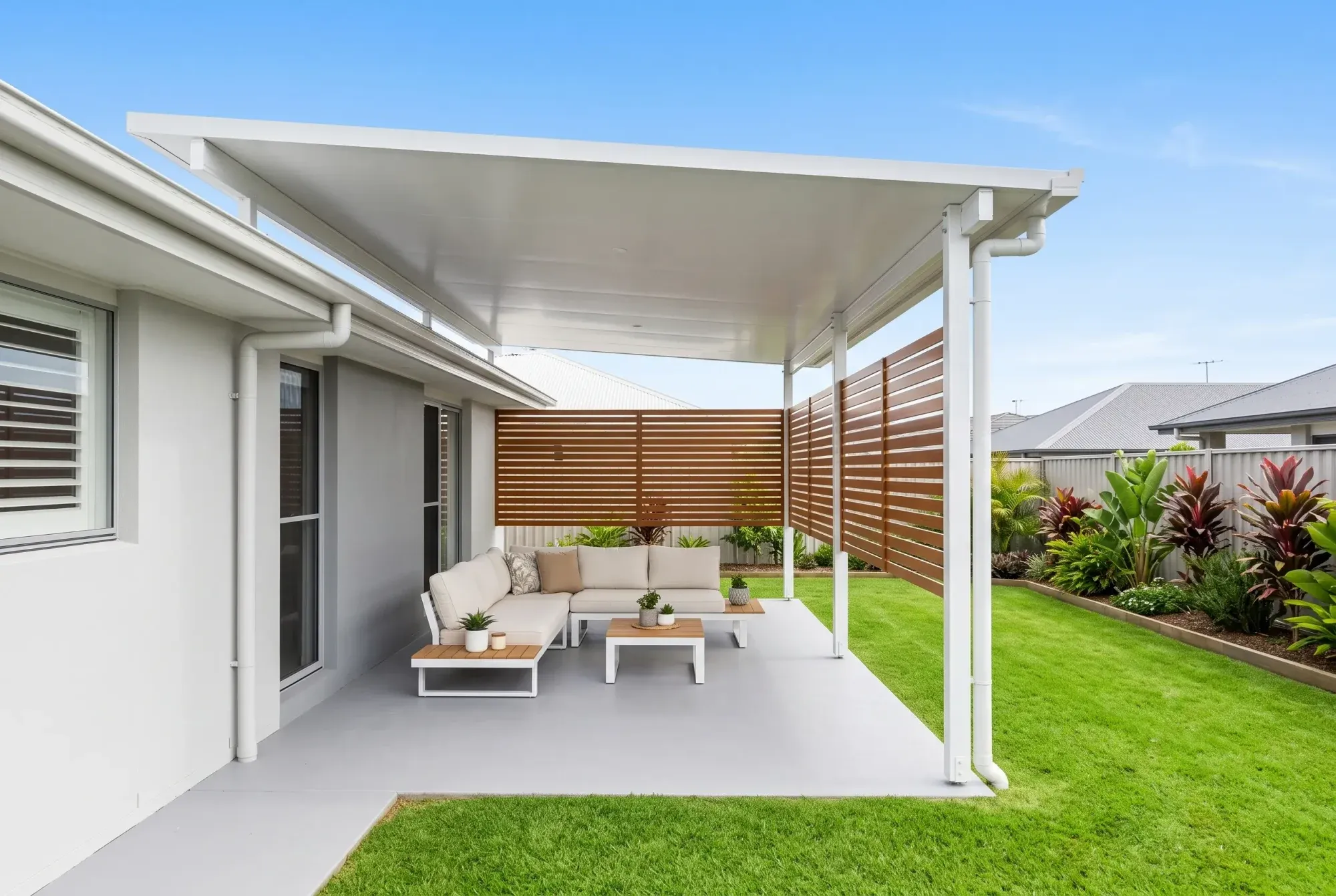 Patio with timber-look privacy screens over an outdoor lounge
